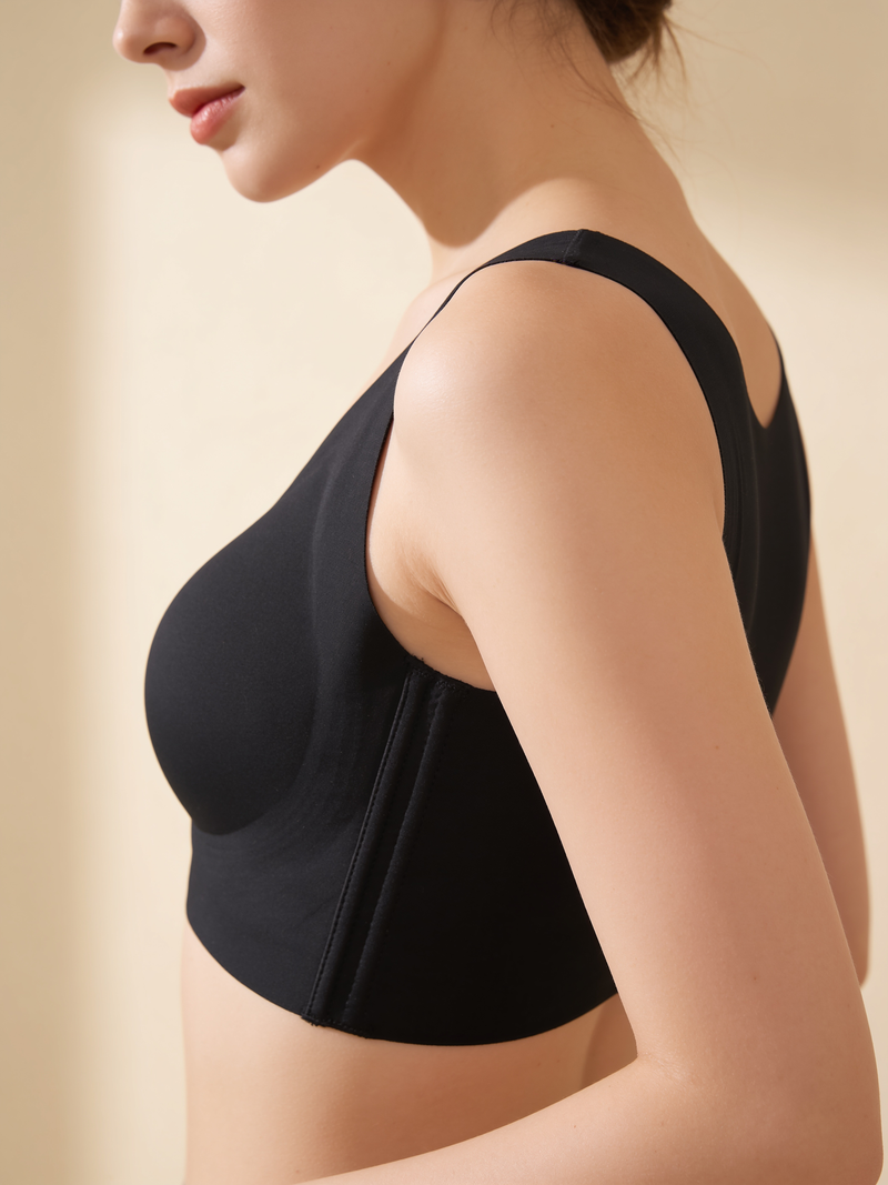 Black posture bra side profile showing the wide strap and side hook-and-eye closure