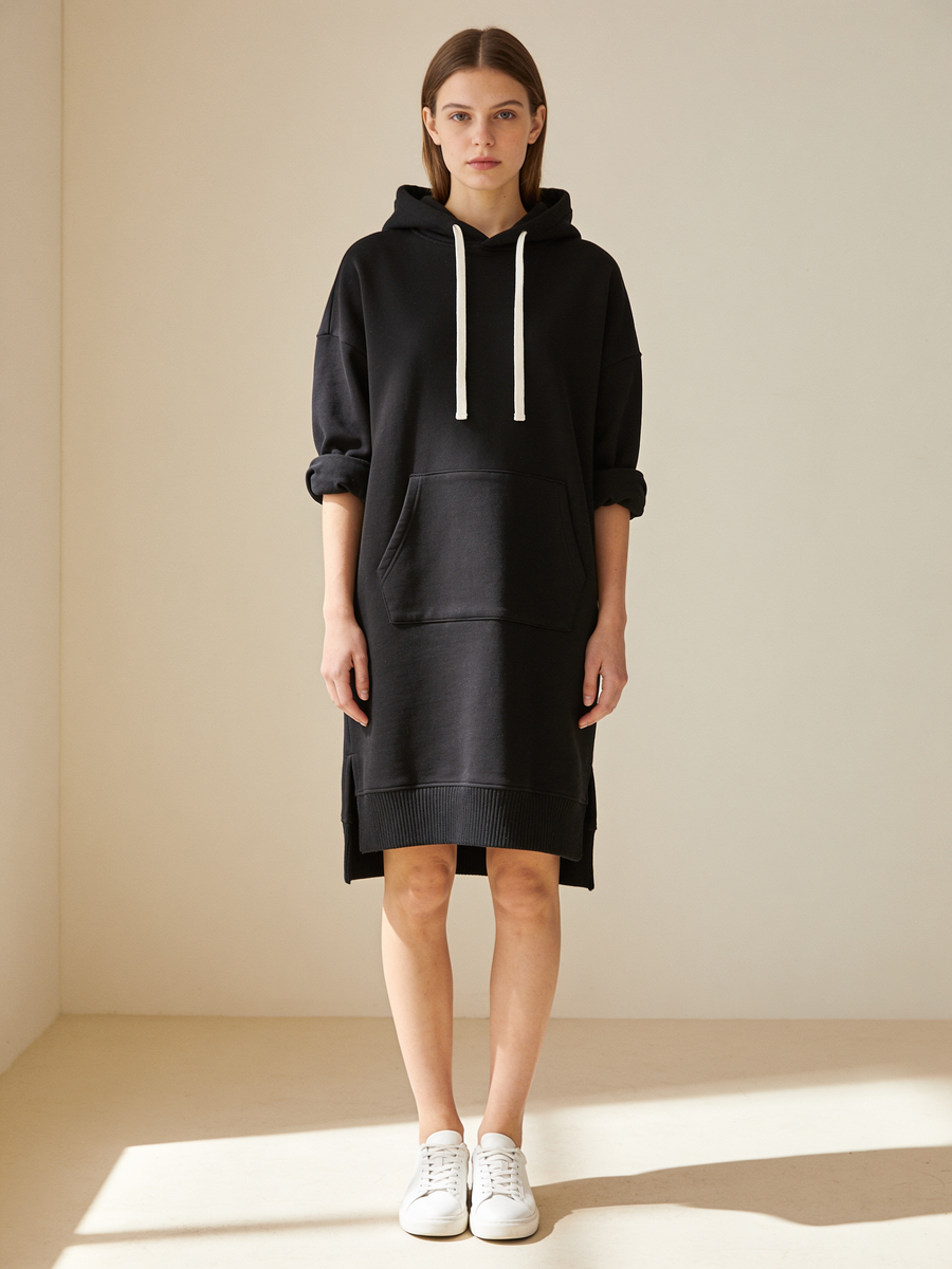 Black oversized hoodie dress with drawstring hood, kangaroo pocket and split side hems